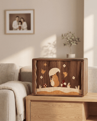 Black walnut sliding door storage cabinet with Totoro inlay on desktop