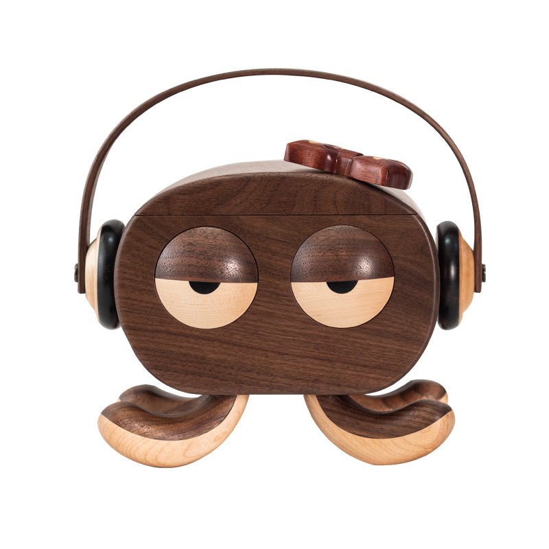 Front view of handcrafted  octopus jewelry box wearing a red cap and headphones, featuring modern minimalist design